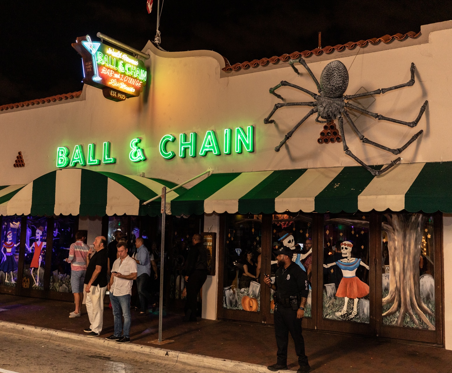 Ball & Chain Halloween decor with a giant spider at the entrance