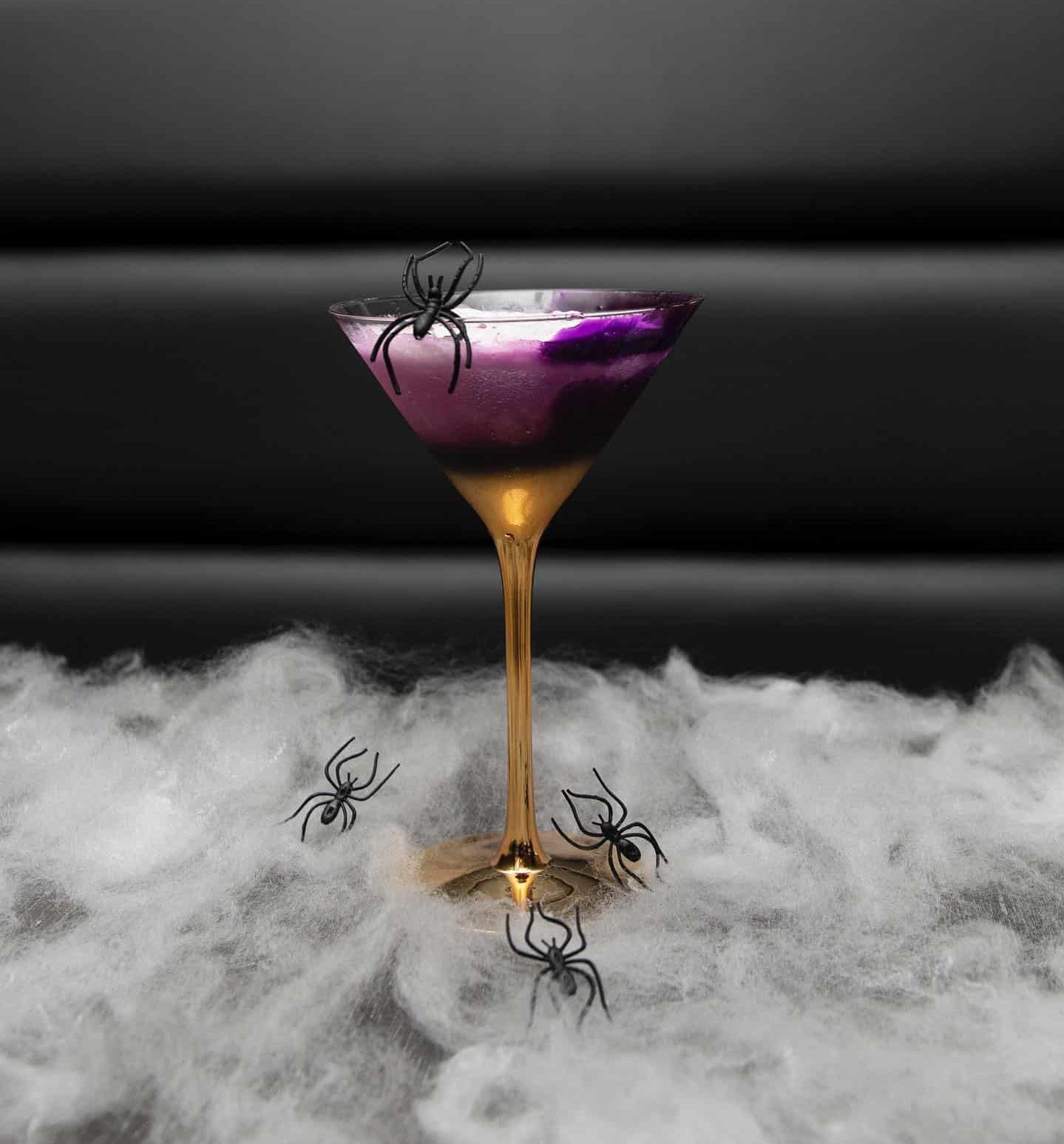W Miami Halloween purple drink with spider decor