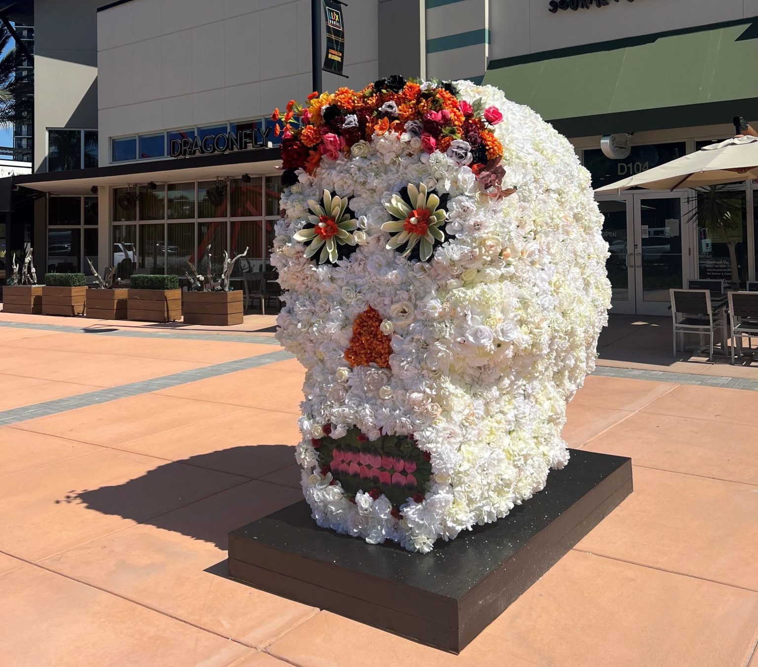 Flora, the six-foot skull made entirely of flowers, at Downtown Doral