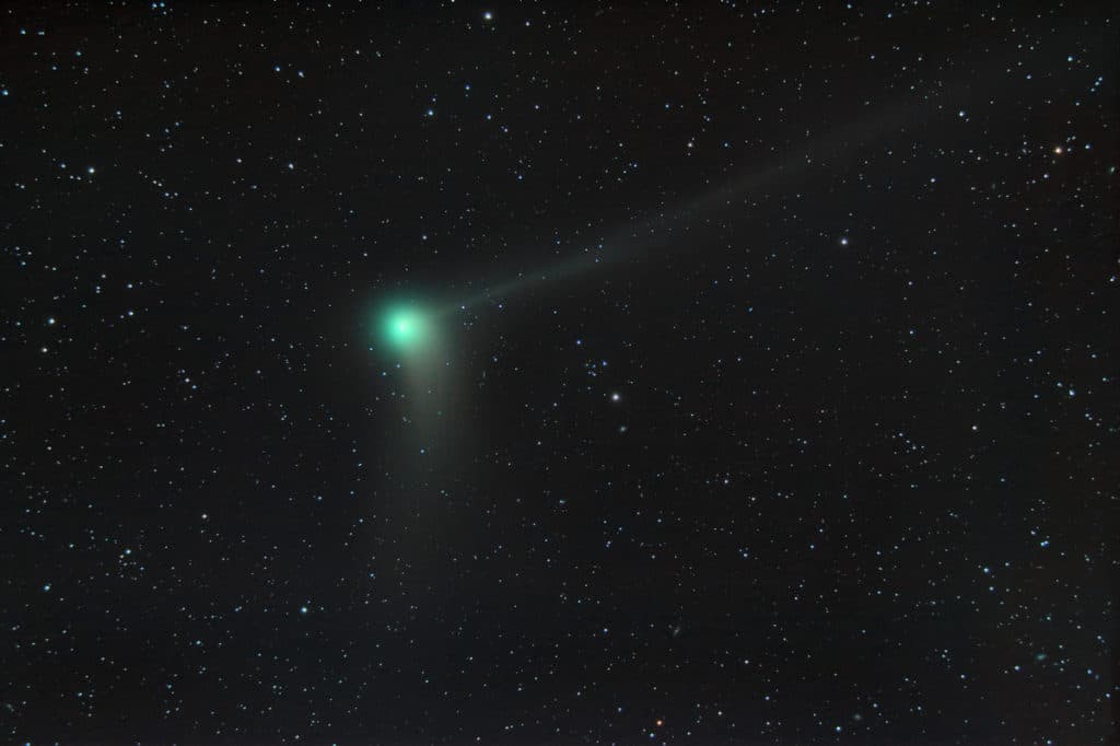 Photo of a comet through a telescope
