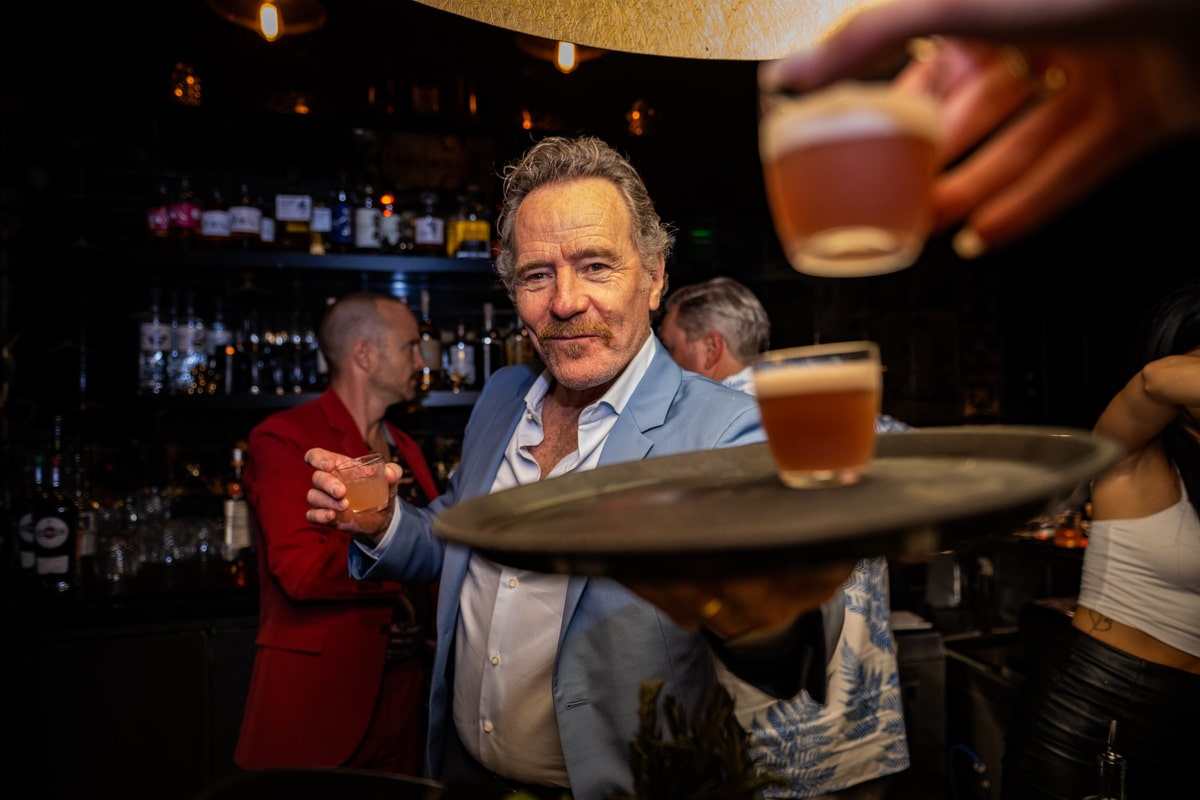 Bryan Cranston serving drinks at Sushi By Bou