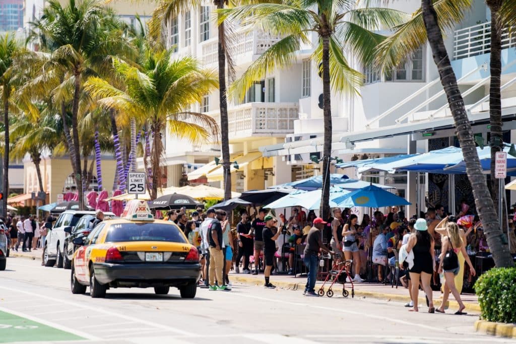Miami Beach, FL, USA - March 12, 2022: Scene on Ocean Drive showing crowds of tourists visiting for Spring Break vacation holiday