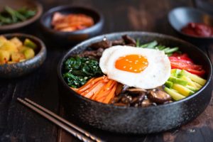 Korean bowl with fried egg and accoutrements