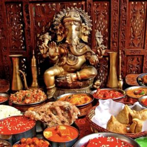 Indian feast with Elephan statue in Bombay Bistro, Miami
