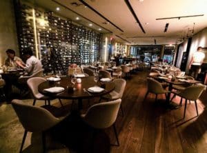 Italian wine selection and indoor seating at Doma in Miami