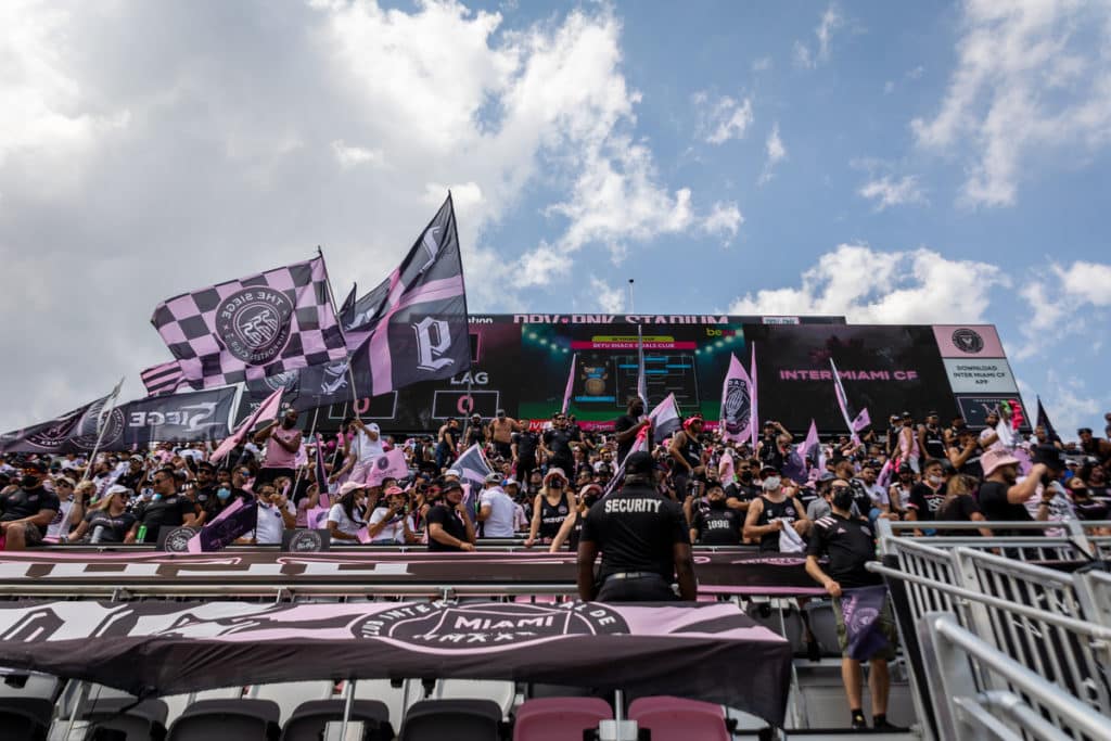 Inter Miami CF fans cheering on their team during a soccer match at MLS 2021 in DRV Pink Stadium
