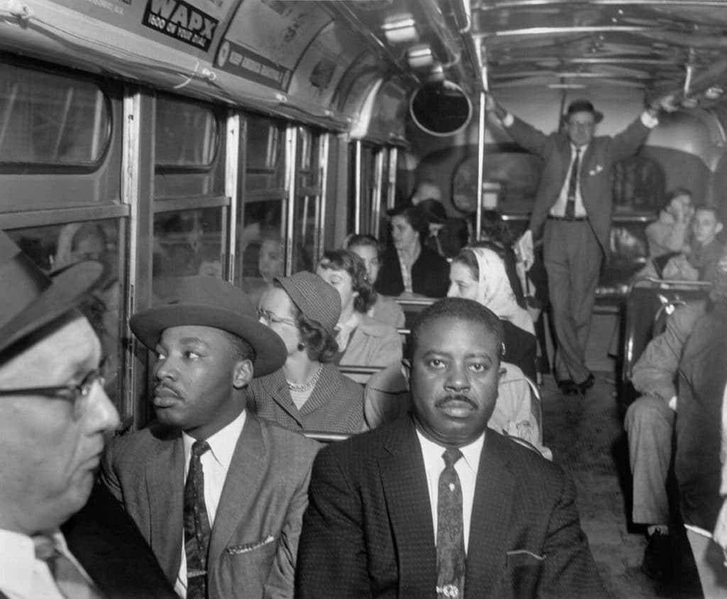 Martin Luther King, Jr., and Ralph Abernathy riding on the first desegregated bus, Montgomery, Alabama