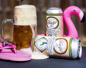 To cans of lager, a pint and a plastic flamingo.